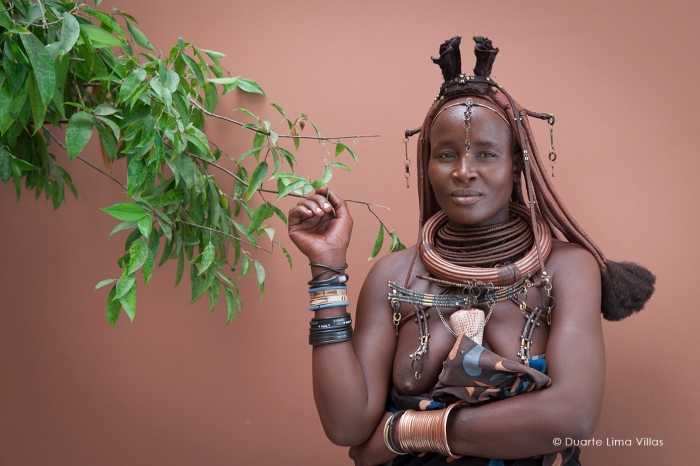 Meet Muacaa Riruaco, a courageous Mumuila representative advocating for health and water supplies in Luanda. Explore the cultural diversity and activism of Angola's Cunene desert.